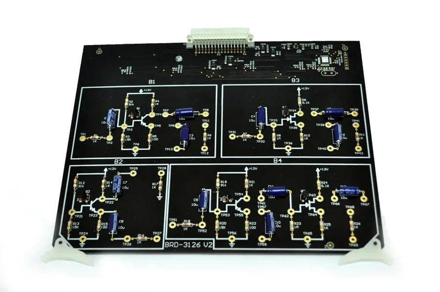 A circuit board with various components, including FET transistors.