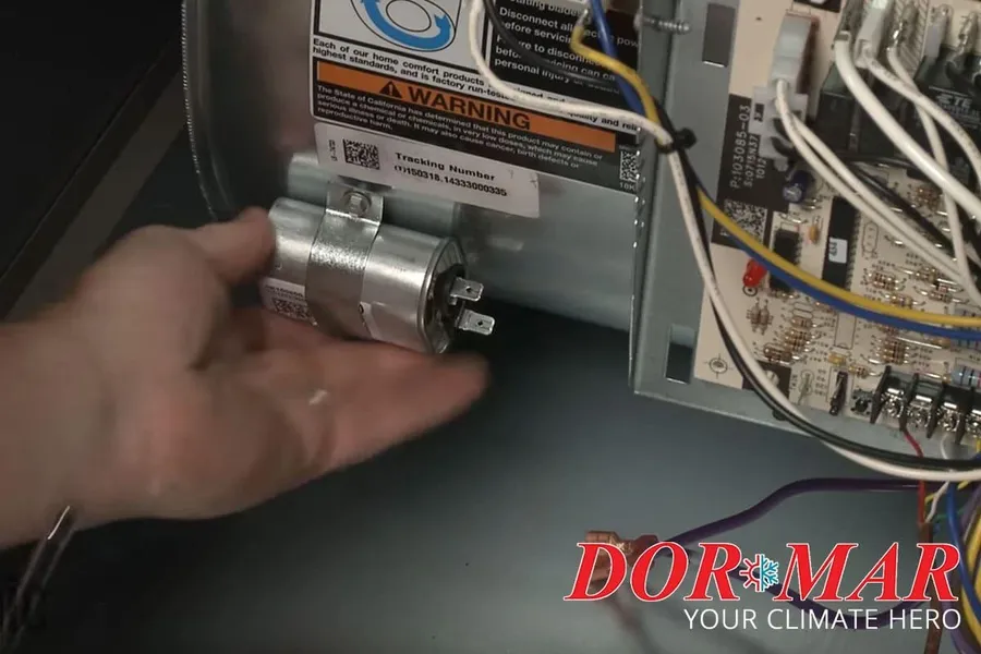 A damaged or bulged motor start capacitor.