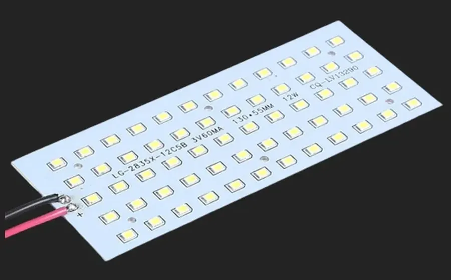 An aluminum LED PCB with LEDs mounted on it.