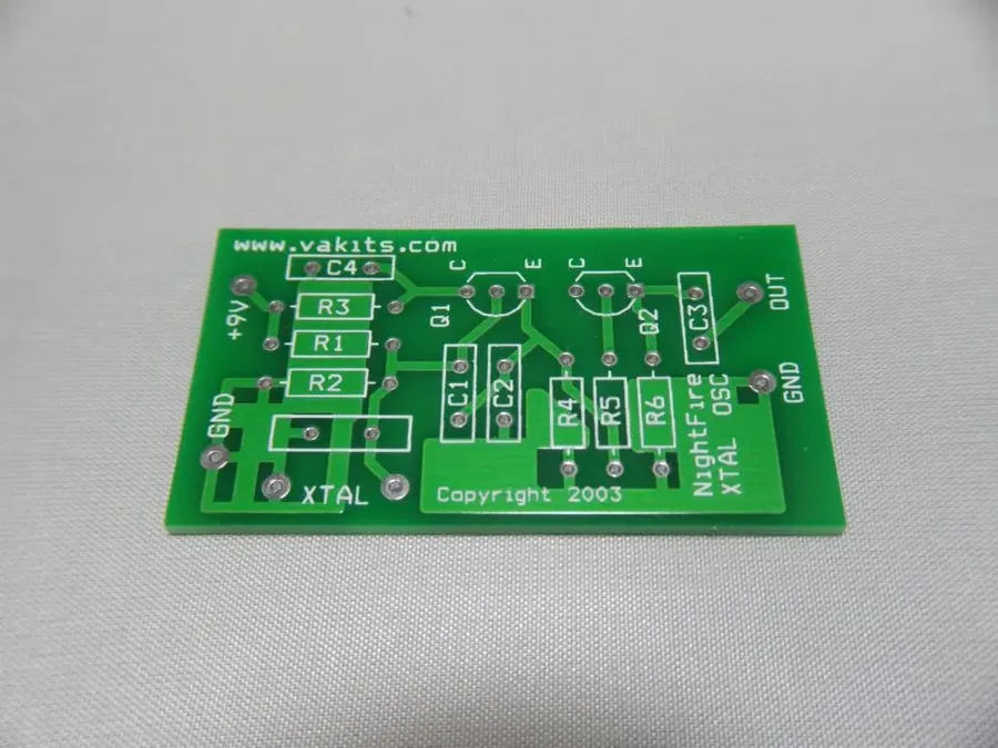 A circuit board with crystal oscillators mounted on it.