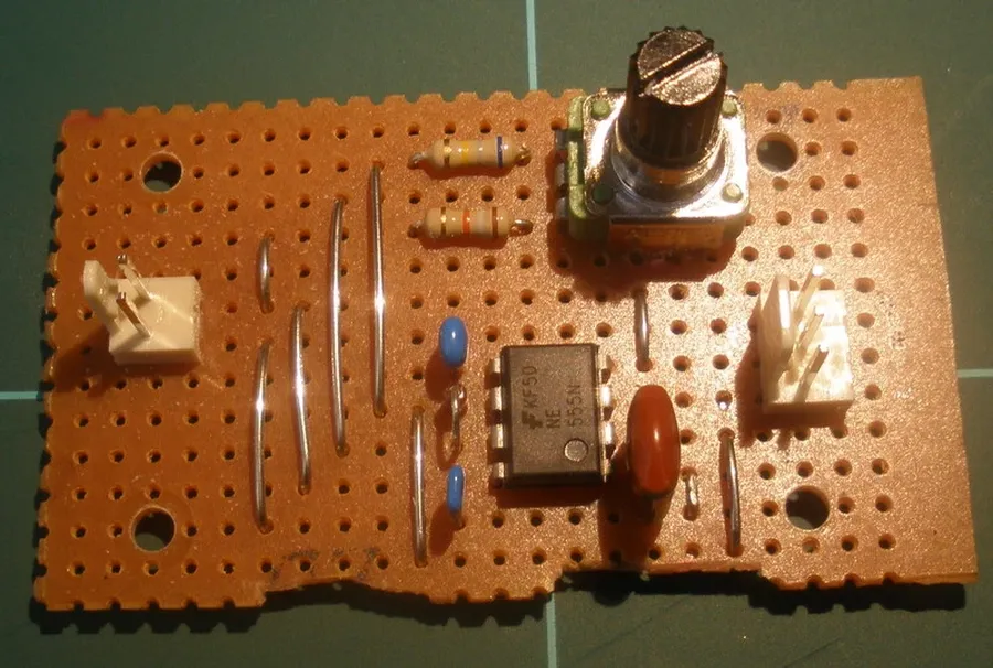 A perfboard with electronic components laid out before soldering.