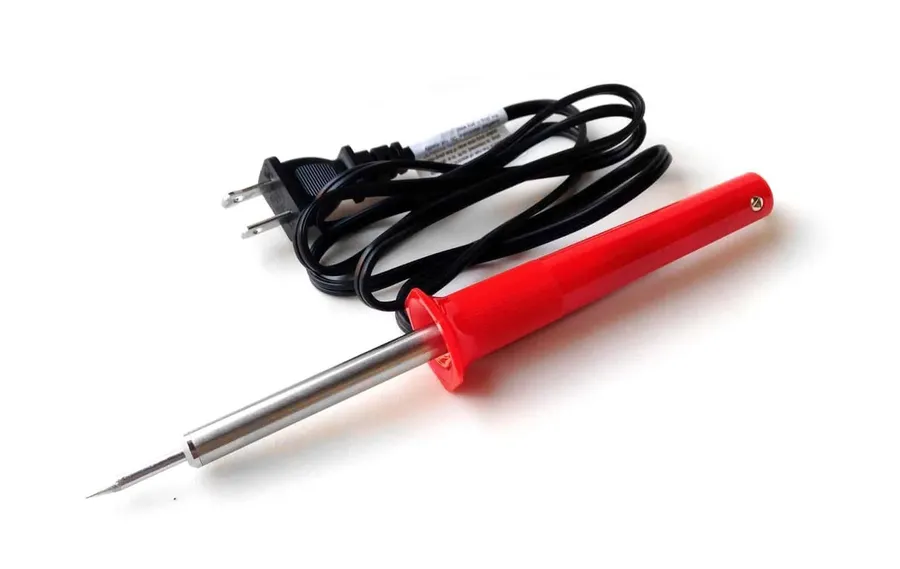 A set of essential soldering tools including iron, solder, and desoldering pump.