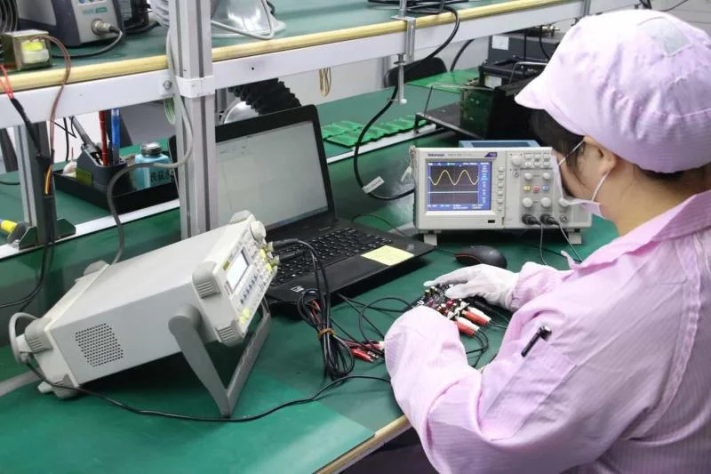 A PCB being tested with testing equipment.
