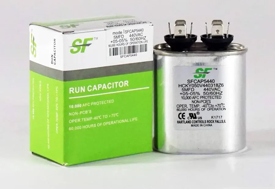 A collection of AC capacitors from different HVAC brands.