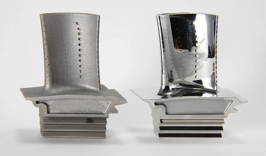 A close up of 3D printed parts showing different surface finishes.
