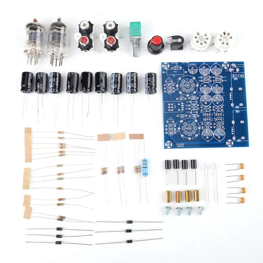 A person assembling a DIY amplifier circuit board.