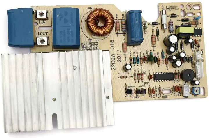Various electronic components on an induction cooker PCB board.