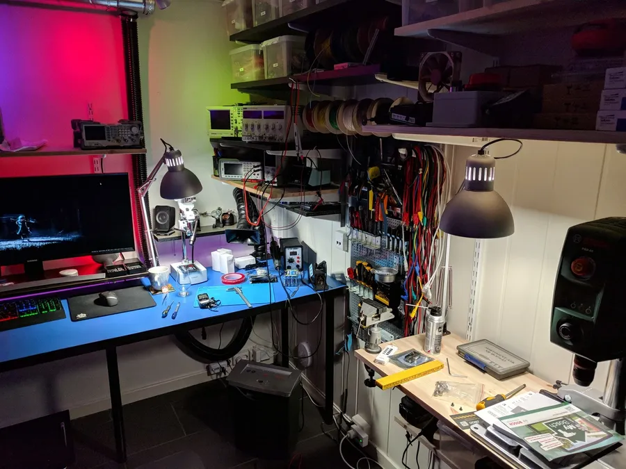 A view of an electronics lab with various equipment and tools.