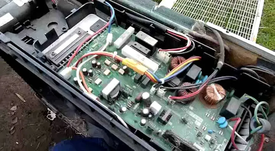A Luminous inverter PCB showing signs of damage, such as burnt components.