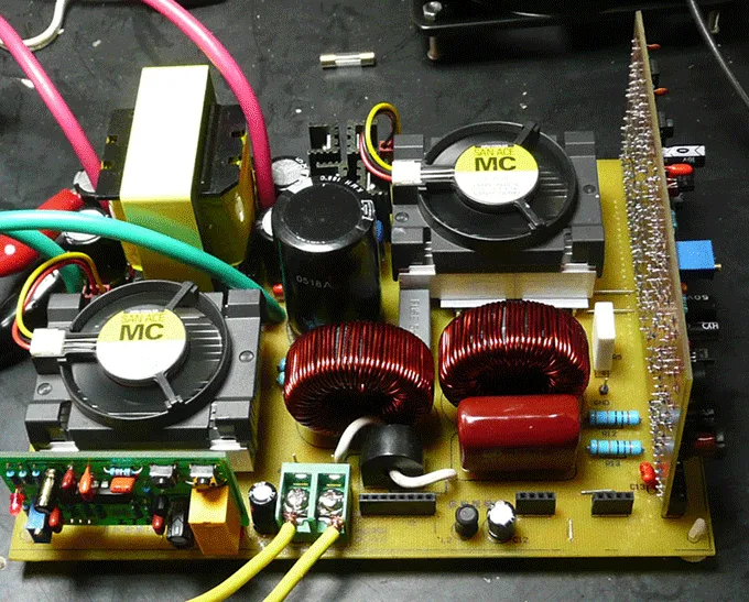 Hands installing a Luminous inverter PCB board into an inverter.