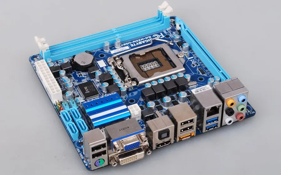 A computer motherboard with visible integrated circuits.