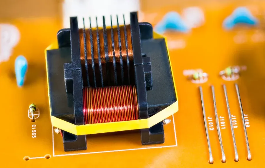 A detailed close-up image of a PCB transformer, showing its construction.