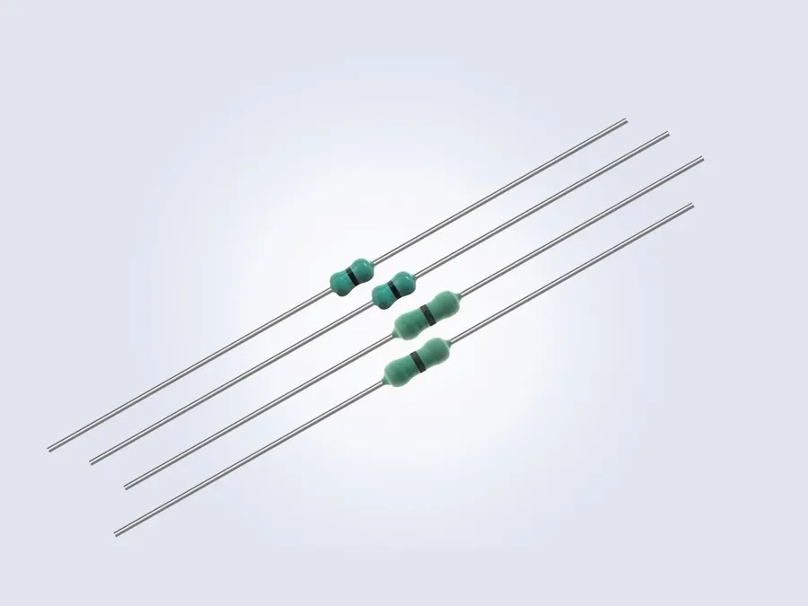 A comparison of a 0 ohm resistor and a jumper wire on a PCB.