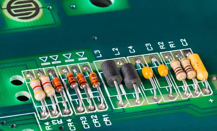 A close-up view of a 200 ohm resistor soldered onto a PCB.