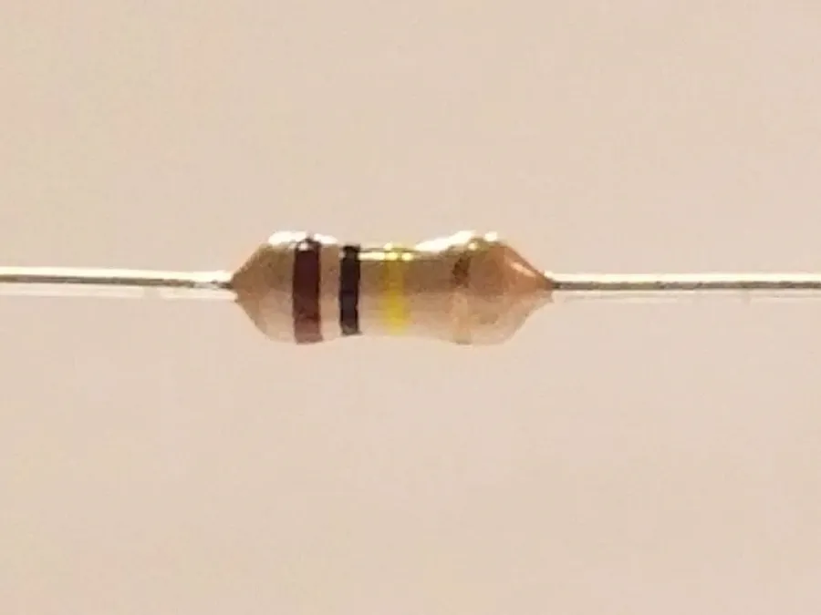 A selection of different 100k ohm resistors, various package types.