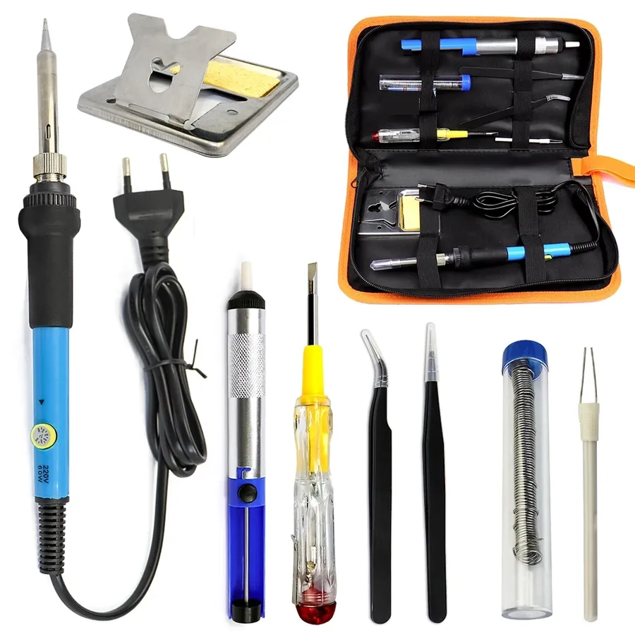 A set of soldering tools including iron, solder, and desoldering pump.