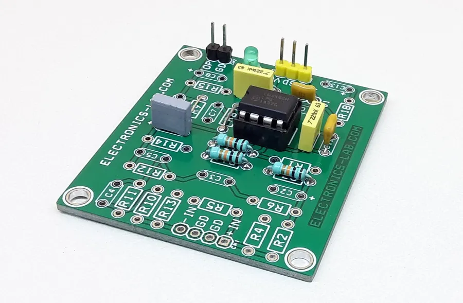 A complex circuit built on a universal PCB board with various components and wires.