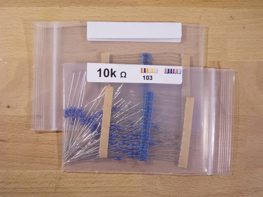 A shelf in an electronics store stocked with resistors.