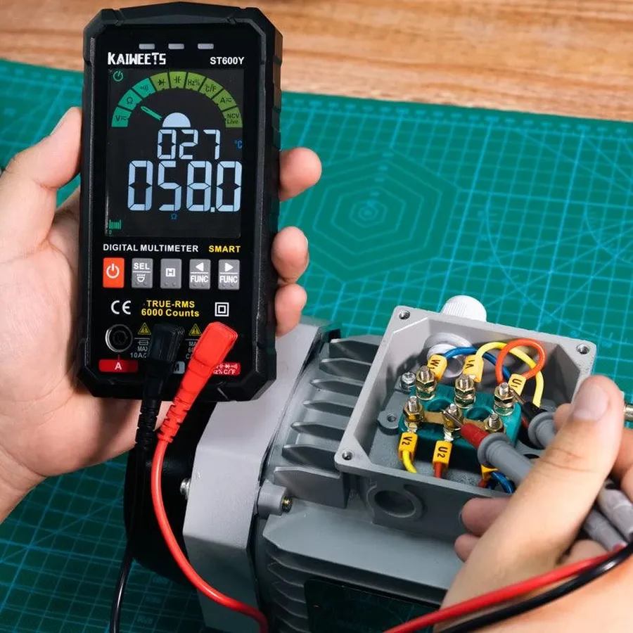 A multimeter being used to measure the resistance of an AC resistor.