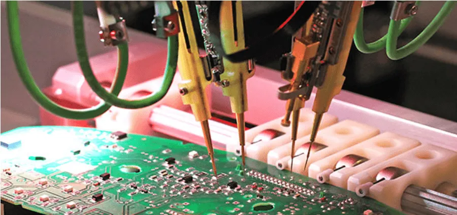A PCB being tested with electrical equipment.