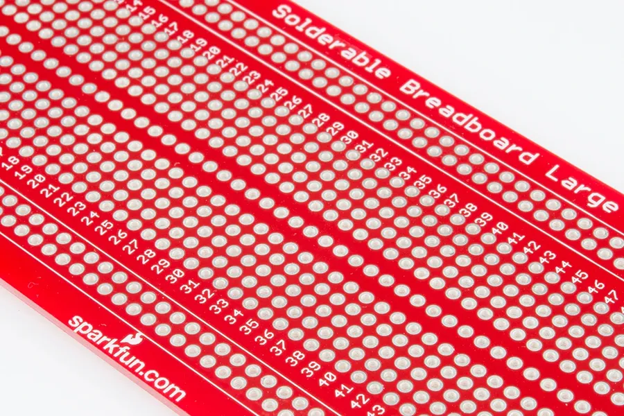 A comparison of a solderable breadboard and a solderless breadboard.