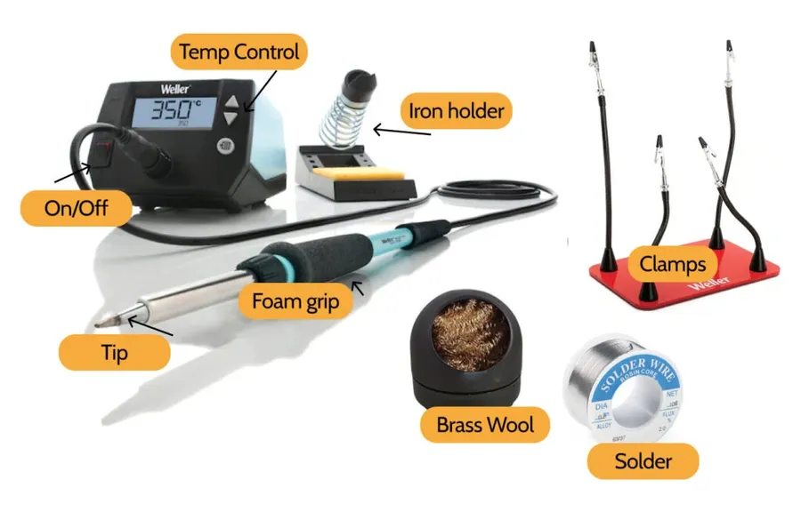 A soldering iron and various electronic components.