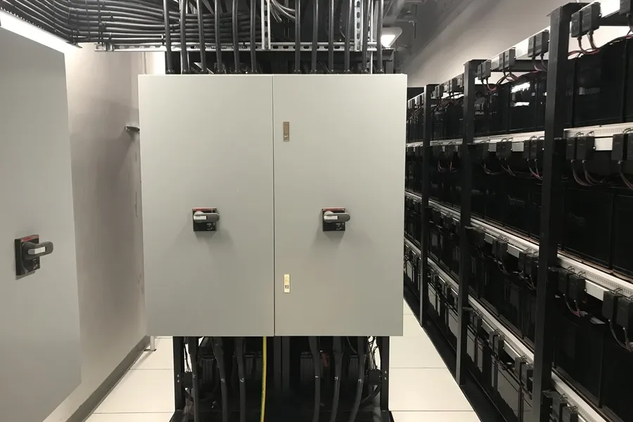A UPS system installed in a server room, showcasing its real-world application.