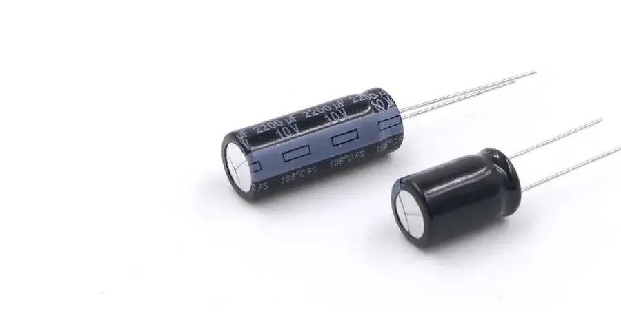 Photo of various electrolytic capacitors, including different sizes and styles.