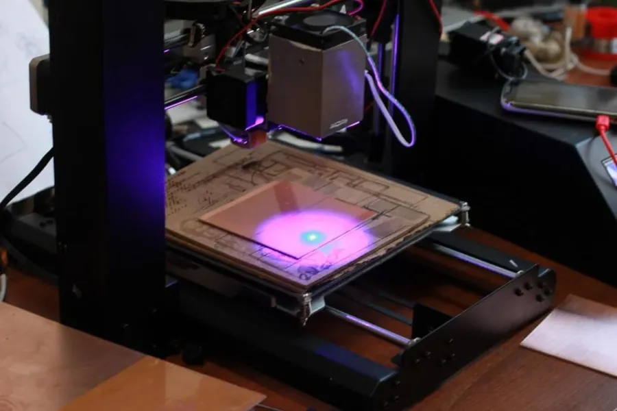 The process of laser engraving a PCB shown step-by-step.