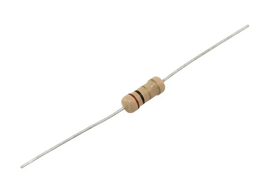 A close up of a carbon film 20k ohm resistor.
