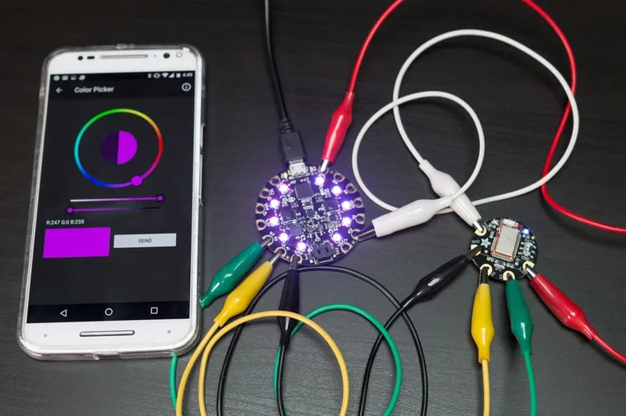 An Adafruit Circuit Playground connected via USB to a computer.