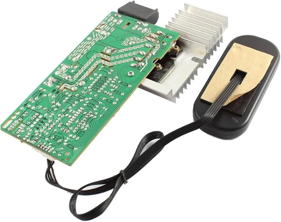 A technician repairing an induction circuit board.