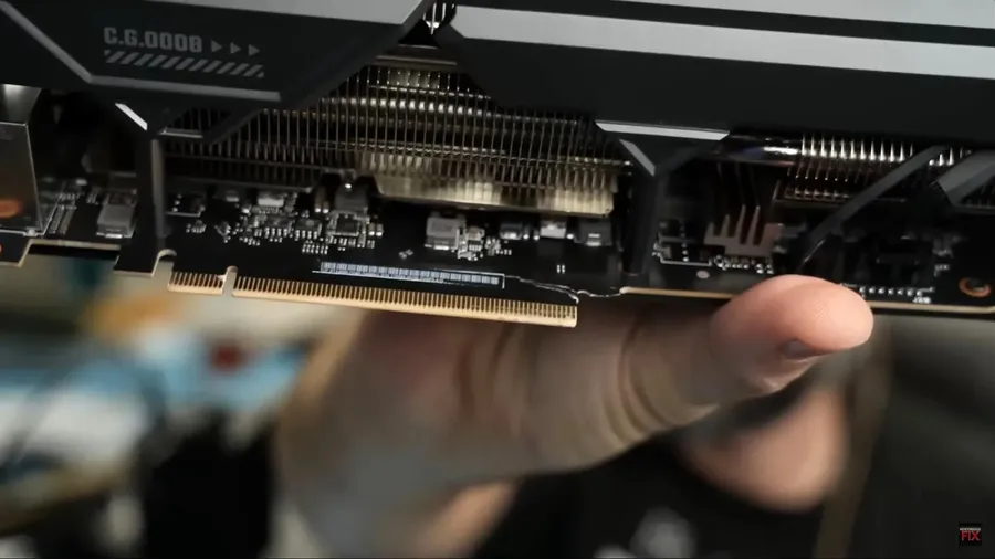 A damaged graphics card PCB with signs of burning.