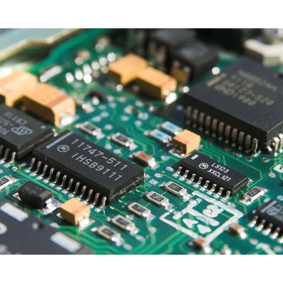 Close-up of electronic components with part numbers and markings.