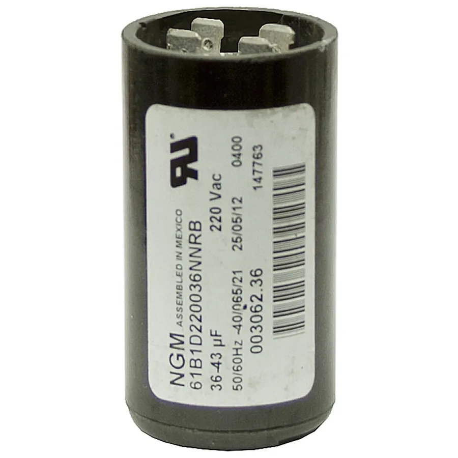 An NGM capacitor being replaced in an electrical system.