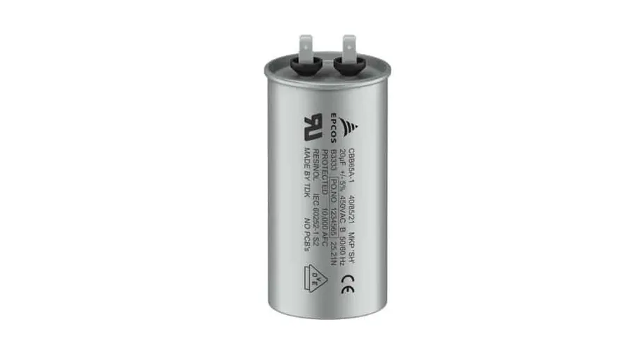 A TDK film capacitor with its casing, showing the film layers inside.