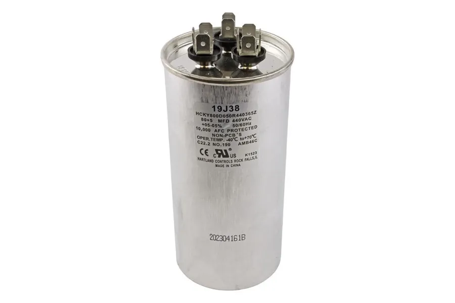 Various Lennox AC capacitors of different shapes and sizes.