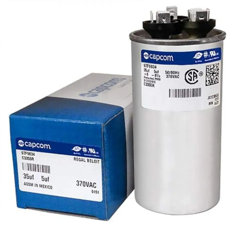 Several different 5uF capacitors side by side, showing size variations.