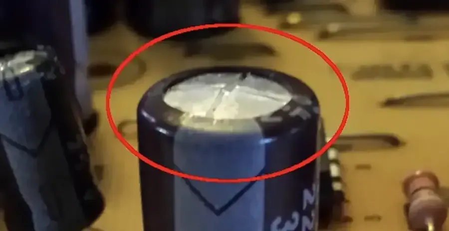 A person replacing a capacitor, showing the process step by step.
