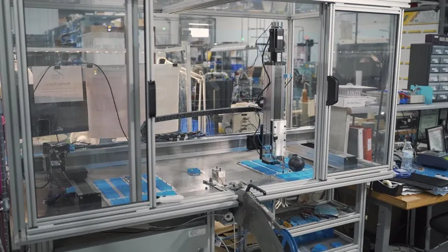 An overview of an LED PCB manufacturing facility with various equipment and workstations.