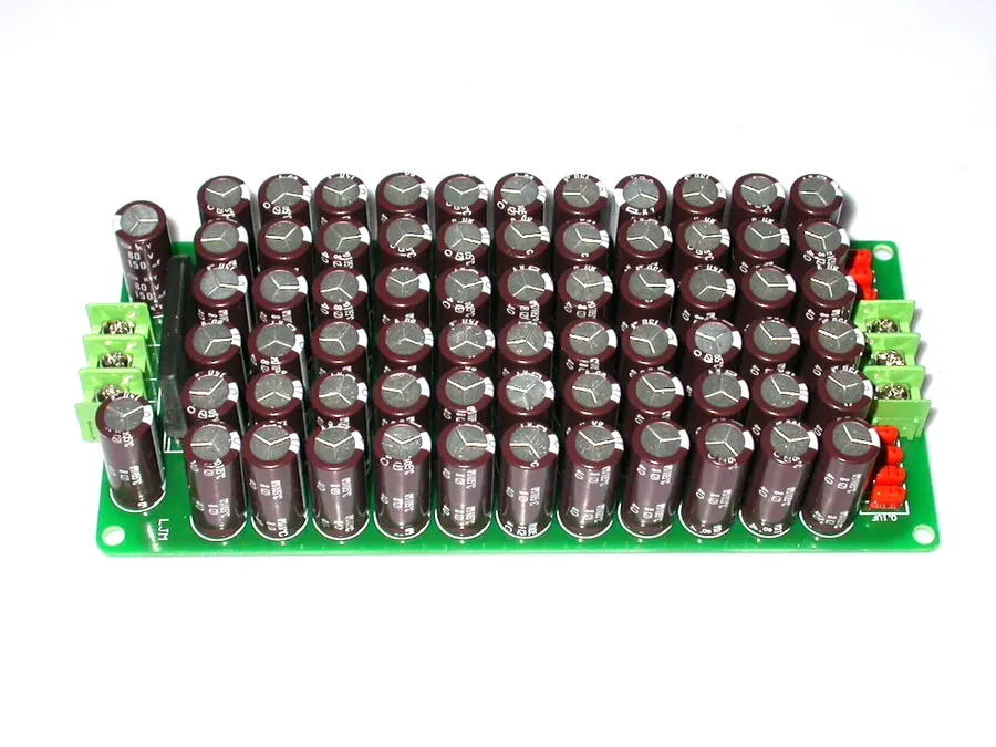 A close-up view of a capacitor array with many large capacitors.