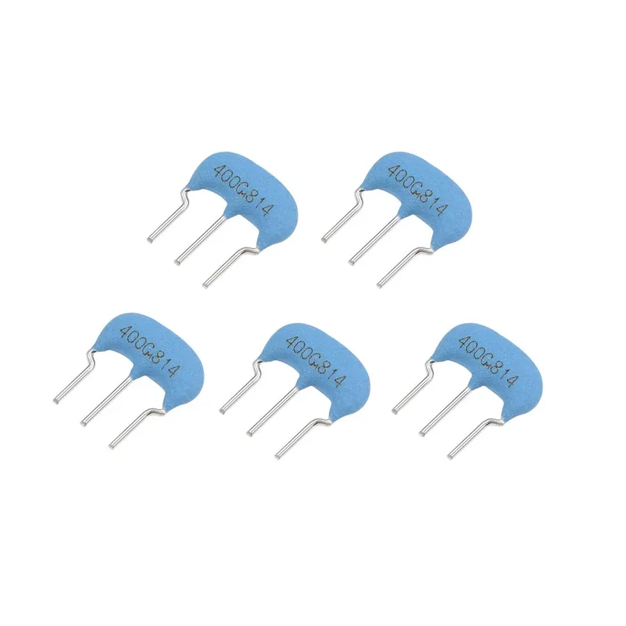 A ceramic resonator with three pins.