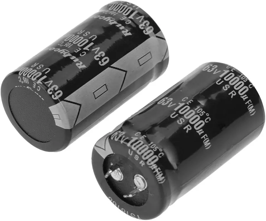 A close-up of an audio circuit board with capacitors.