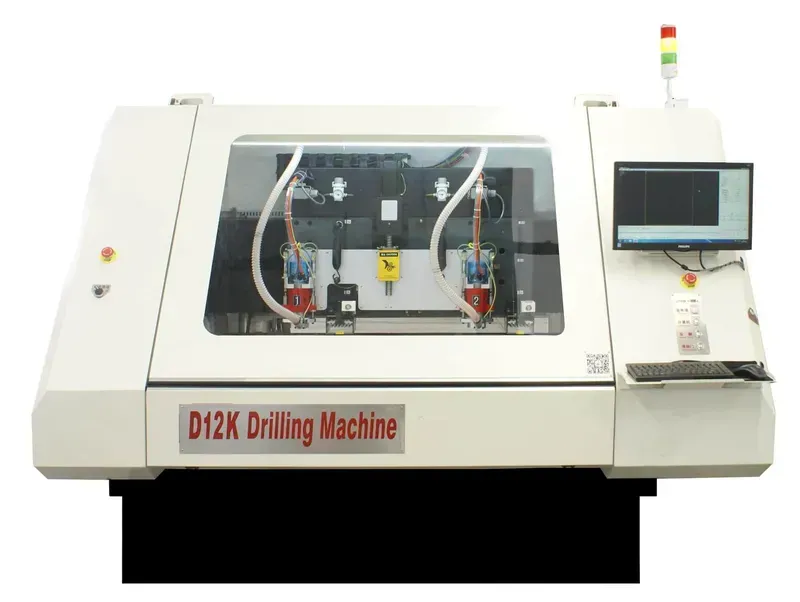 A CNC drilling machine fabricating a PCB